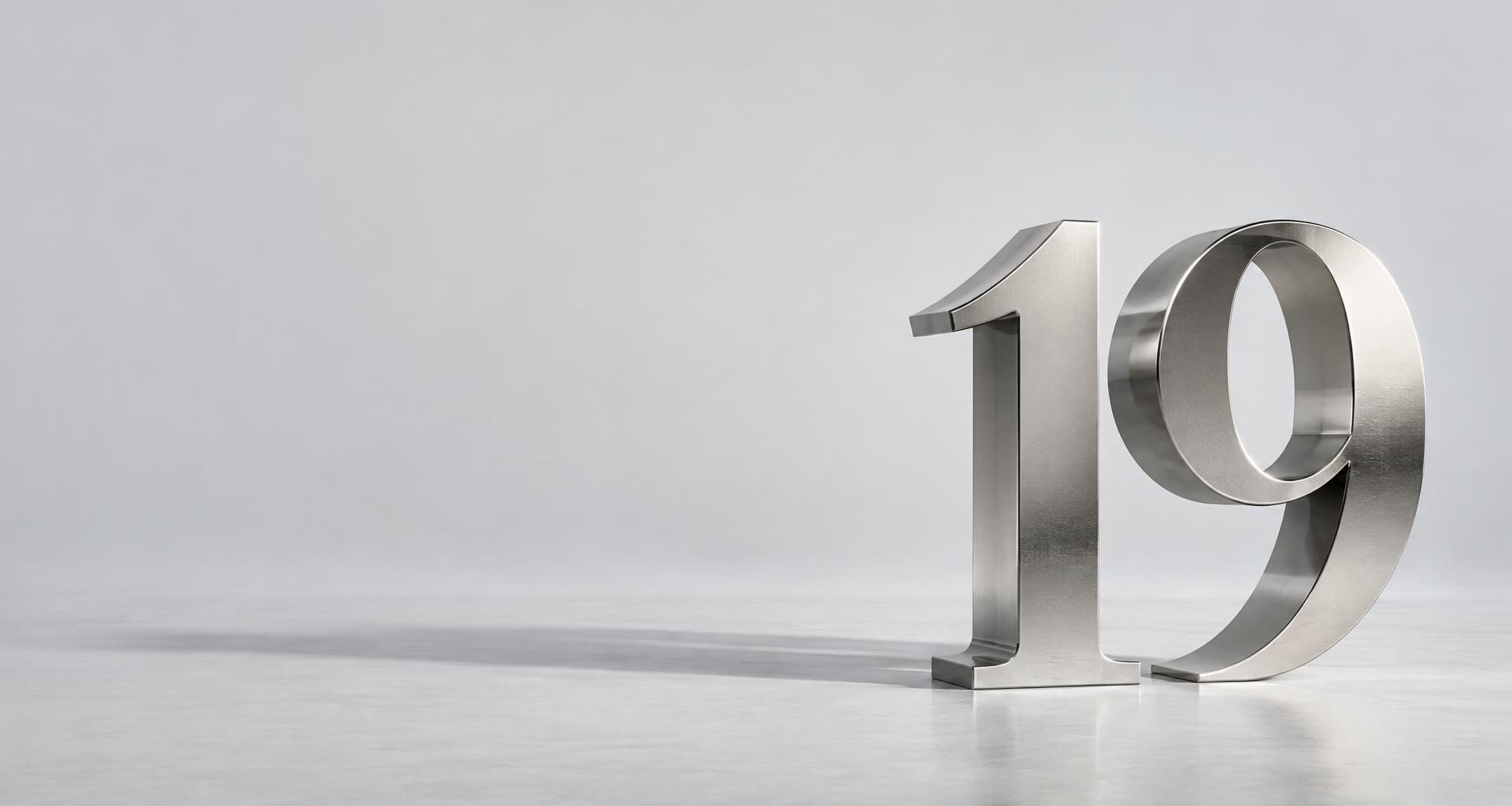 A sculptural brushed-metal number nineteen